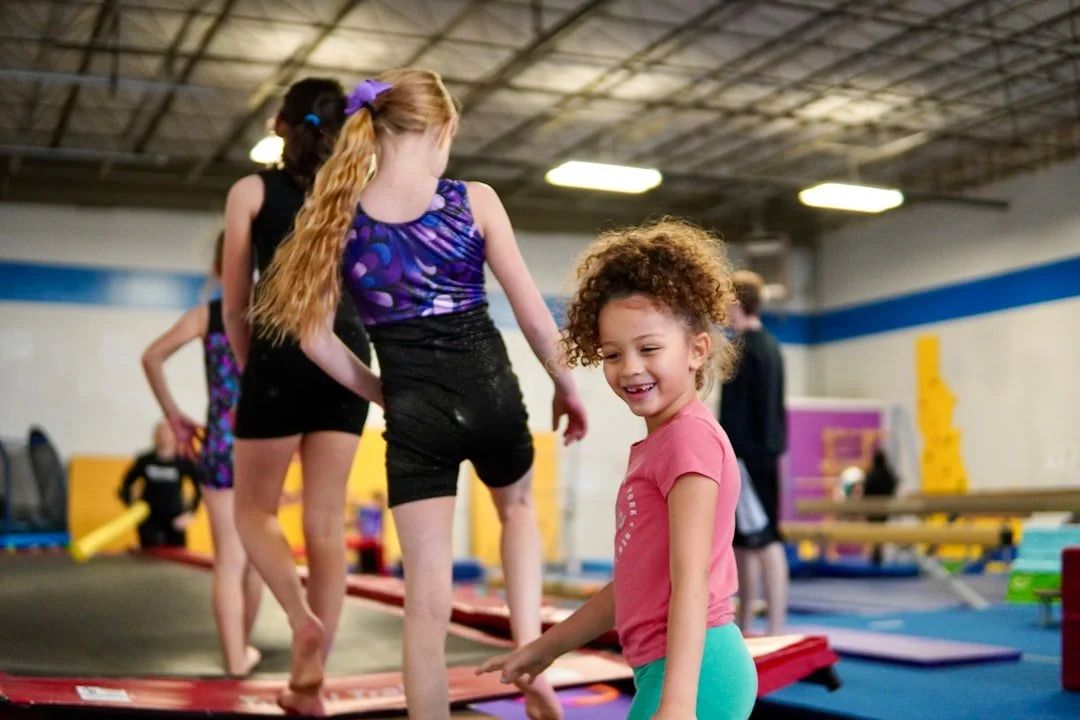 A smiling camper in the gym during summer camp